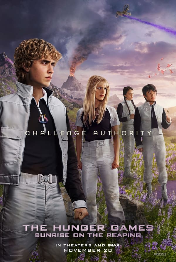 Movie poster for The Hunger Games: Sunrise on the Reaping showing four young tributes in white uniforms standing in a rocky field beneath a smoking volcano and stormy sky, with a hovering aircraft overhead.