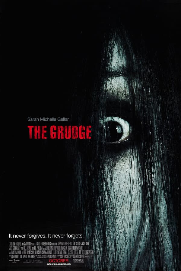 The promotional poster for 'The Grudge' features a close-up of a haunting face partially obscured by long black hair, with a stark white eye and dark shadows. The title is prominently displayed in red text, emphasizing the horror theme.