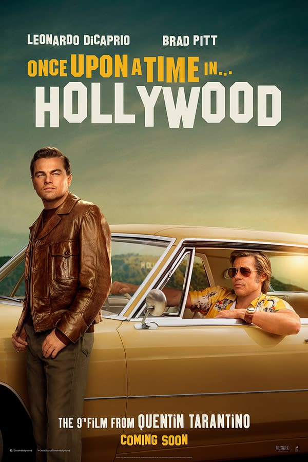 A promotional poster for the film 'Once Upon a Time in Hollywood' featuring actors Leonardo DiCaprio and Brad Pitt. DiCaprio leans against a vintage car wearing a brown leather jacket, while Pitt sits inside wearing sunglasses and a colorful shirt.