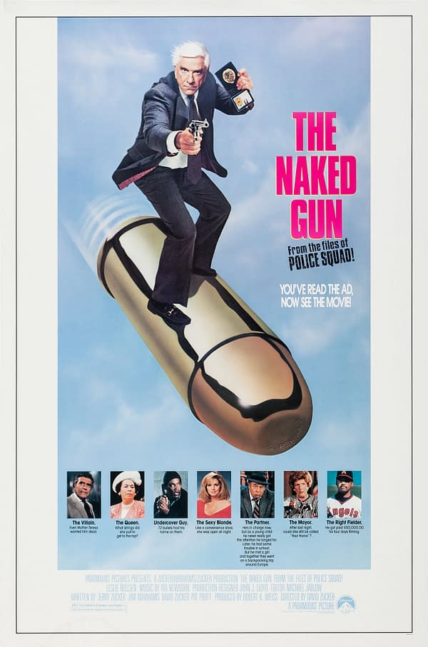 A movie poster for 'The Naked Gun' features a main character dramatically posing with a gun and badge while standing on a large bullet. The title is displayed prominently in pink text, along with a tagline and images of supporting characters. The overall design has a humorous and action-packed theme.