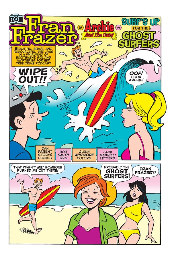 A colorful cartoon panel featuring Archie and his friends at the beach. A surfer wipes out in the waves while two girls watch from the shore, and characters display a mix of surprise and amusement at the scene.