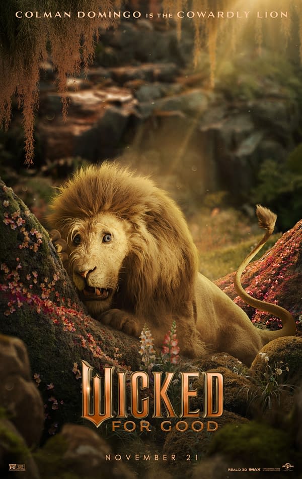 A cartoon-style illustration features the Cowardly Lion, portrayed by Colman Domingo, peeking out from behind a tree, surrounded by colorful flowers in a magical forest setting. The text "WICKED FOR GOOD" is prominently displayed at the bottom with a release date of November 21.