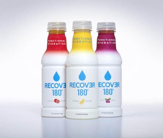 A couple of different bottles of RECOVƎR 180° flavors.