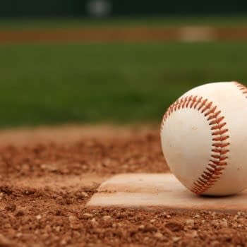 Baseball on Home Plate -- David Lee/Shutterstock.com