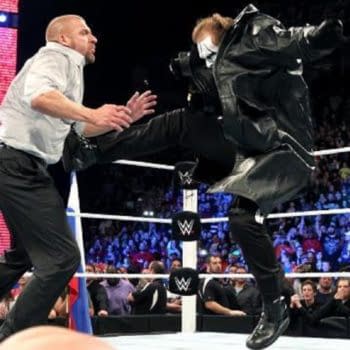 Sting takes on Triple H, courtesy of WWE (screencap).