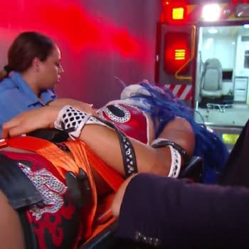 Sasha Banks is taken away in an ambulance after a vicious attack by former best friend Bayley on WWE Smackdown.