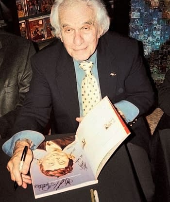 Mort Drucker, signing MAD Magazine in 2000. Photo by Gustavo Morales.