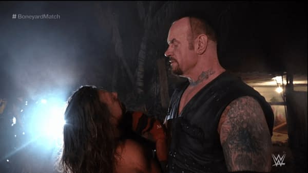 It's AJ Styles taking on The Undertaker in a Boneyard Match, courtesy of WWE.