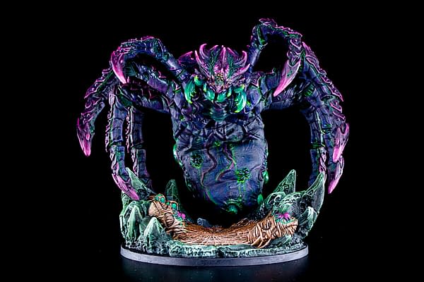 A painted version of the miniature for the Spider Tyrant, the titular boss monster from this Epic Encounters boxed set by Steamforged Games.