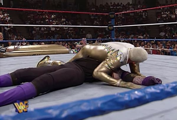 Dustin Rhodes has The Undertaker in a pinning predicament.