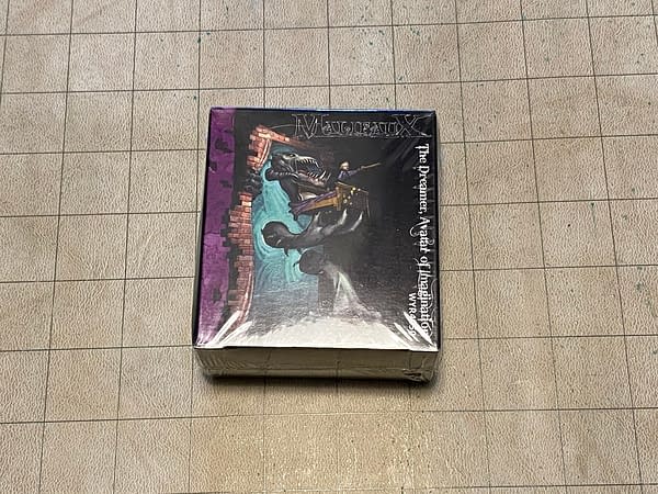 The front face of the still-sealed box for The Dreamer, Avatar of Imagination, a miniature by Wyrd Miniatures for the first edition of their game Malifaux that has been out of print since 2012. Will I open it? Read on, and see.