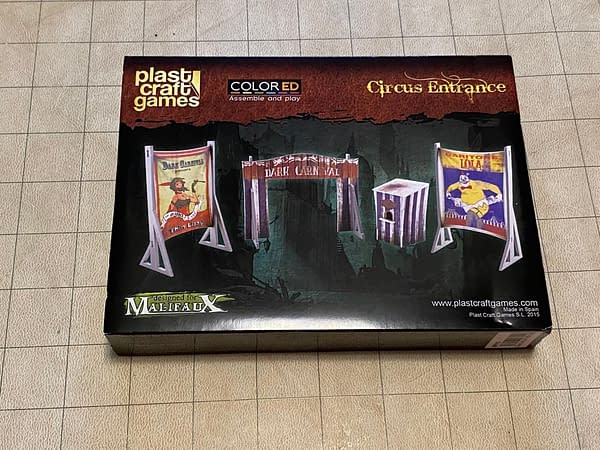 The front cover of the Circus Entrance boxed set by Wyrd Miniatures and Plastcraft, made for use with Wyrd's game Malifaux.