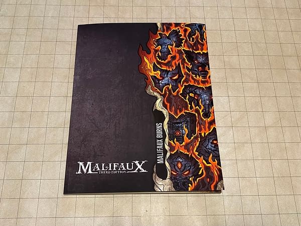 The front cover for Malifaux Burns, a supplemental book for the tabletop skirmish wargame Malifaux by Wyrd Games.