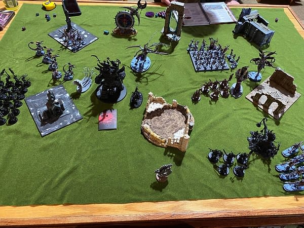 The end of the first battle round for the game between the Maggotkin of Nurgle and the Hedonites of Slaanesh in Age of Sigmar, a wargame by Games Workshop. Photo credit: Josh Nelson
