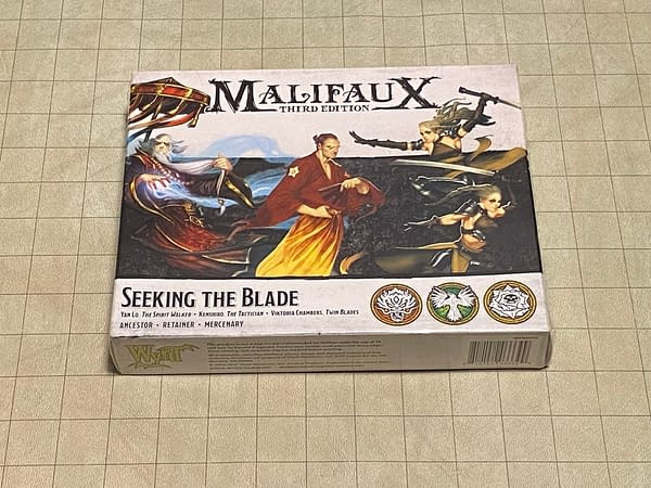The front face of the box for Seeking the Blade, a boxed set for the third edition of Malifaux, a tabletop skirmish game by Wyrd Games.