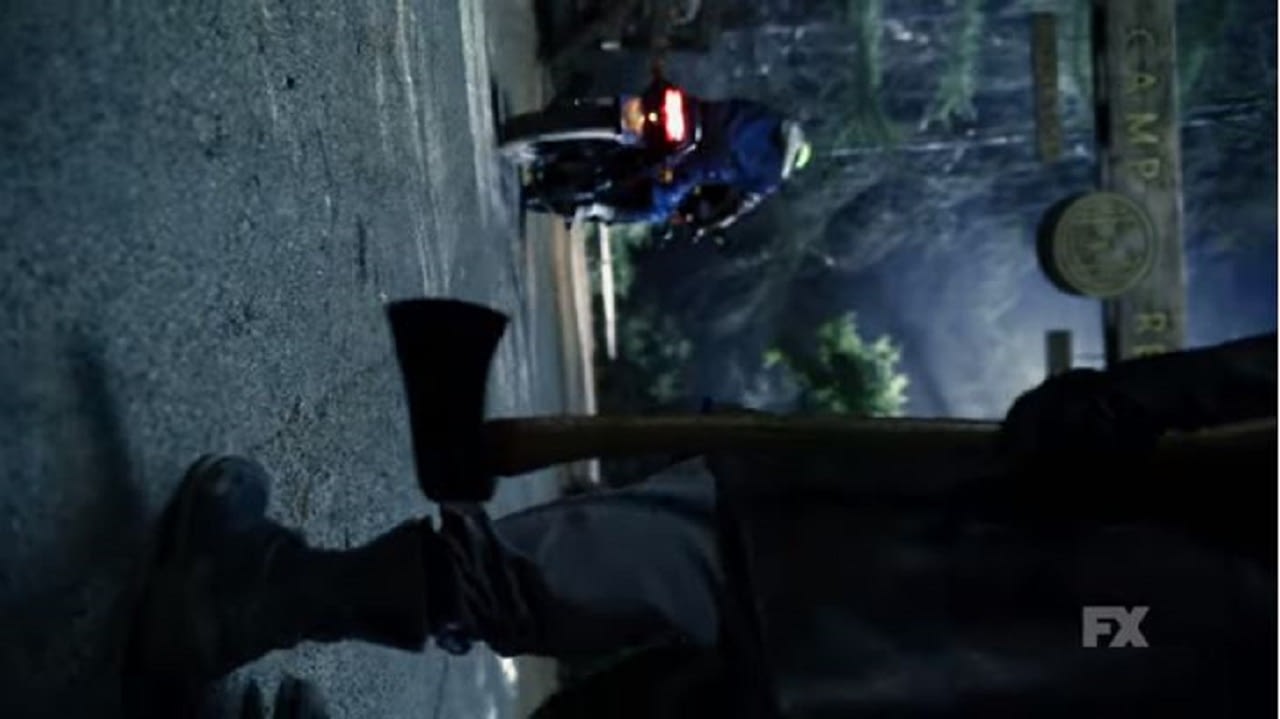 Mr. Jingles (John Carroll Lynch) pursues two fleeing counselors on a Ninja motorcycle. 