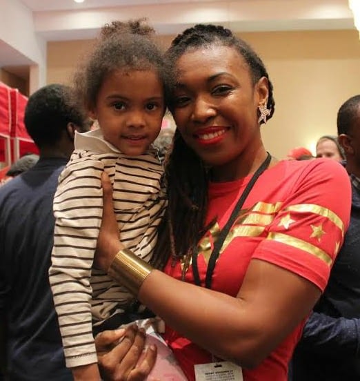 Richardson and her biggest fan Stella were all smiles at NC Comicon. Photo courtesy Pierce Freelon.